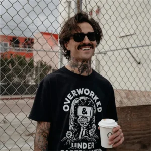 Coffeinated Overwork Under Skull Print T-Shirt Men's Coffee-Themed Top As Unique Office Gift The Best Coffee Shirt